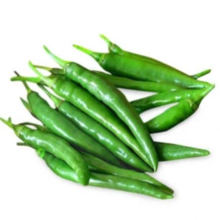 Green Chillies Heap Close on a White Background from Panzer's