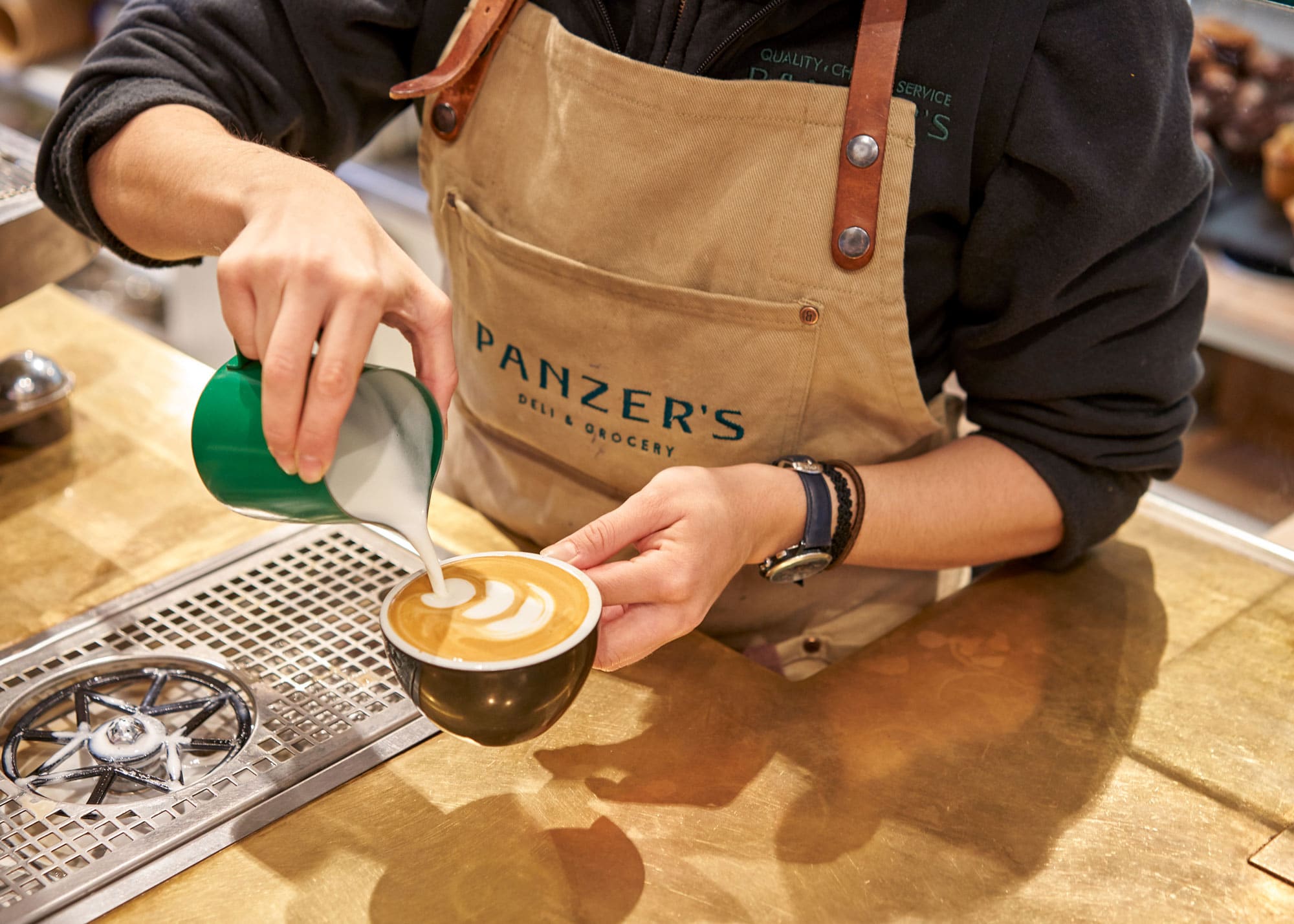 Barista pouring a capuccino