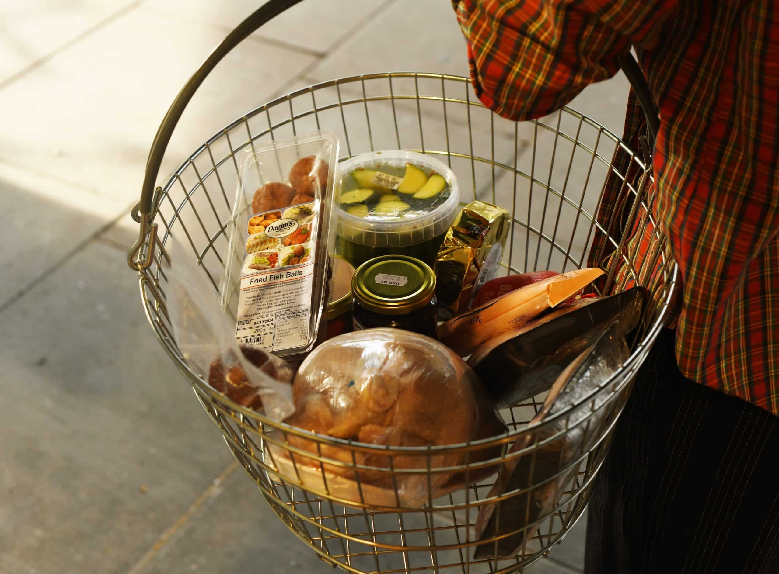 a basket full of kosher products available at Panzer's deli, from fish balls to kosher chicken & pickles